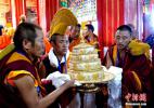 Oct. 18, 2016 -- Monks in Meiri Monastery consecrates Manja, a Buddhist instrument, to the 11th Panchen Lama Bainqen Erdini Qoigyijabu. On September 10, the 11th Panchen Lama Bainqen Erdini Qoigyijabu visited the Meiri Monastery. (Photo by Li Lin)