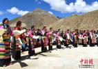 Oct. 18, 2016 -- Local villagers dance for the 11th Panchen Lama Bainqen Erdini Qoigyijabu. On September 10, the 11th Panchen Lama Bainqen Erdini Qoigyijabu visited the Tubujia Town in Shigatse of China’s Tibet Autonomous Region. (Photo by Li Lin)