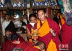 Oct. 18, 2016 -- The 11th Panchen Lama Bainqen Erdini Qoigyijabu gives blessings to religious believers. On September 10, the 11th Panchen Lama Bainqen Erdini Qoigyijabu visited the Gandanrebujie Monastery in Shigatse of China’s Tibet Autonomous Region. (Photo by Li Lin)