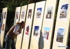 Nov. 14, 2016 -- A visitor watches a photo exhibition showcasing natural and cultural beauty of southwest China`s city of Lhasa in Kathmandu, Nepal, Nov. 11, 2016. Organized by the China Cultural Center in Nepal, the photo exhibition entitled `Charming Lhasa` has been held here on Friday with more than 30 photos on display. (Xinhua/Sunil Sharma)    