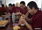 Nov. 18, 2016 -- Monks have a meal at Qinghai Tibetan Buddhism College in Guide County, northwest China`s Qinghai Province, Nov. 16, 2016. The first batch of 120 monks have started their four-year full-time study at the newly-opened Tibetan Buddhism college recently. (Xinhua/Zhang Hongxiang)