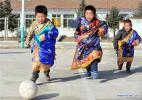Nov. 28, 2016 -- Pupils play football at Daiqian school in Zhuaxixiulong Township of Tianzhu Tibetan Autonomous County, northwest China`s Gansu Province, Nov. 24, 2016. To increase the enrollment rate of schools, especially ensure Tibetan children`s access to education, about 62 schools of the county have concentrated the efforts in training teachers and attracting more competent faculties as well as improving conditions for teaching facilities. (Xinhua/Guo Gang)