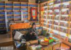 Dec. 7, 2016 -- A lady is absorbed in reading at the `Paradise Time Travel Bookstore` located next to the Princess Wencheng Theater in Lhasa, Tibet Autonomous Region, on Dec. 1, 2016. [Photo by Han Jiajun/China.com.cn]