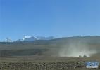 Dec. 21, 2016 -- Photo taken on Dec. 9 shows SUVs running on the road of Shigatse City, southwest China`s Tibet Autonomous Region. With an average altitude of 4000 meters, Shigatse City is vast in territory and the terrain is diverse. In winter, snow-capped mountains in this region is towering and magnificent.[Xinhua/Liu Dongjun]