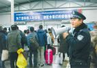Jan. 4, 2017 -- Photo shows a policeman at Lhasa Railway Station is busy maintaining the order to ensure safe transportation. [Photo/China Tibet News]