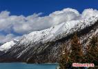 Jan. 10, 2017 -- Ranwu Lake is called `the Tibetan Switzerland.` The lake is set more than 3,800 meters above sea level and has an area of 22,000 square km. The seasons dictate the water`s color, which ranges from aquamarine to turquoise. When the sun rises, the lake looks like a mirror reflecting snow-capped mountains, white clouds and the surrounding forest.[China.org.cn/VCG]