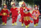 Jan. 25, 2017 -- Children dressed up as roosters send gifts to elderly people in Hefei City, capital of East China`s Anhui province, Jan 24, 2017, to greet the upcoming Spring Festival which falls on Jan 28. Chinese people are busy with preparing for the upcoming Spring Festival, the most important family reunion festival in China, which falls on Jan 28 this year.[Photo/Xinhua]