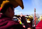Feb. 9, 2017 -- Monks perform religious ceremony at a pole near the Jokhang Temple in Lhasa, capital of southwest China`s Tibet Autonomous Region, Feb. 8, 2017.