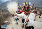 Feb. 15, 2017 -- Baima people in Longnan play Chigezhou to bless the village in Shimengou Village, Wenxiantielou Tibetan County, Longnan City, Gansu Province on February 10, 2017. (Photo / Caiyang)