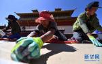 May 2,2017--On April 20, construction workers are using the traditional `aga` method to repair the roof of Samye Monastery. [Photo/Xinhua]