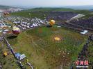 July 19,2017--In July, Gannan’s grasslands boast green grass and cool breeze. Data shows that more than 100,000 visitors home and abroad and Tibetan locals participated in the Gannan Shambhala Tourism Festival at Dangzhou Grassland. (Photo by Yang Yanmin)