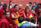 Aug.10,2017--Tashilhunpo means `auspicious land` in Tibetan. It is the traditional seat of successive Panchen Lamas and is the largest monastery of Gelug Sect in Tibetan Buddhism`s in rear Tibet. Photo shows the Panchen Lama touches the tops of people`s heads to give them blessings.