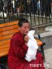 Aug.10,2017--Photo shows a monk shed tears after seeing the Panchen Lama. 
