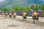 Aug. 21, 2017 -- Photo shows the scene of horse racing which is a traditional activity celebrated during Ongkor Festival. [Photo/China Tibet News]