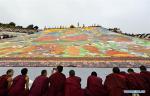 Aug. 22, 2017 -- A large thangka painting of the Buddha is exhibited at Drepung Monastery in Lhasa, capital of southwest China`s Tibet Autonomous Region, Aug. 21, 2017. Buddhists and believers thronged Lhasa for the start of the traditional Shoton Festival. The Shoton Festival, also known as the Yogurt Banquet Festival, is a week-long gala held since the 11th century. (Xinhua/Liu Dongjun)