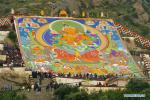 Aug. 22, 2017 -- A large thangka painting of the Buddha is exhibited at Drepung Monastery in Lhasa, capital of southwest China`s Tibet Autonomous Region, Aug. 21, 2017. Buddhists and believers thronged Lhasa for the start of the traditional Shoton Festival. The Shoton Festival, also known as the Yogurt Banquet Festival, is a week-long gala held since the 11th century. (Xinhua/Liu Dongjun)