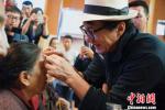 Aug. 28, 2017 -- Jackie Chan displays gauze meant for an eye surgery patient.