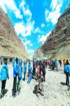 Oct. 8, 2017 -- Domestic and international tourists are hiking around the Holy Mountain named Kang Rinpoche in Ngari of southwest China’s Tibet Autonomous Region. [China Tibet News/ Gelsang Jigme]