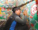 Oct. 26, 2017 -- A worker is repairing the mural of Khorzhak Monastery in Burang County, Ngari Prefecture, Tibet Autonomous Region. [China Tibet News/Phentok]