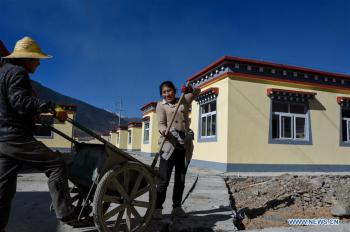 Impoverished villagers in China‘s Tibet move into new houses
