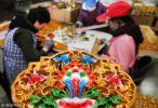 Nov. 21, 2017 -- Villagers make Tibetan home decorations in Yanggang village in Jiuhua town, Rugao city, East China`s Jiangsu province, Nov 20, 2017. [Photo/VCG]