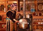 Nov. 22, 2017 -- A brightly costumed villager prepares food in Nyingchi, southwest China`s Tibet Autonomous Region, Nov. 17, 2017. The long-standing and unique Tibetan costumes and ornaments here feature diversified styles, patterns and colors. (Xinhua/Jigme Dorje)