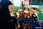 Nov. 24, 2017 -- Volunteer teacher Wu Tongyu tells stories at a class at Bohai Primary School in Dagcanglhamo Township, Luqu County of Gannan Tibetan Autonomous Prefecture, northwest China`s Gansu Province, Nov. 17, 2017. Since 2015, 400 college students from universities within Gansu province have been dispatched to poor and ethnic regions as volunteer teachers in Gansu every year, which have contributed to the development of all-round education in these regions. (Xinhua/Liu Jinhai)