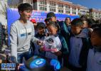 Nov. 24, 2017 -- On Nov. 21, students of Lhasa Beijing Experimental Middle School are receiving roller skating tools. [Xinhua/Liu Dongjun]