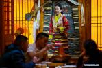 Nov. 28, 2017 -- A performer sings during a live show in Po Ba Tsang restaurant in Lhasa, capital of southwest China`s Tibet Autonomous Region, Nov. 26, 2017. The restaurant`s name, Po Ba Tsang, means Tibetan home. In recent years, restaurants like Po Ba Tsang, which are featured with ethnic and cultural elements, become popular in Lhasa. (Xinhua/Liu Dongjun)