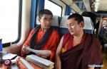Dec. 1, 2017 --  Monks discuss the sutra of Tibetan Buddhism on a train in southwest China`s Tibet Autonomous Region, Nov. 29, 2017. Tibetans from Qinghai and Gansu provinces took train home after their journey of pilgrimage or travelling. (Xinhua/Chogo)