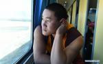 Dec. 1, 2017 --  Dolang, a monk from Tibetan Autonomous Prefecture of Golog in northwest China`s Qinghai Province, looks out of the window on a train in southwest China`s Tibet Autonomous Region, Nov. 29, 2017. Tibetans from Qinghai and Gansu provinces took train home after their journey of pilgrimage or travelling. (Xinhua/Chogo) 