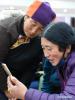 Dec. 1, 2017 --  Passengers from northwest China`s Qinghai Province chat with their families via a mobile phone at the waiting room of Lhasa Railway Station in Lhasa, capital of southwest China`s Tibet Autonomous Region, Nov. 29, 2017. Tibetans from Qinghai and Gansu provinces took train home after their journey of pilgrimage or travelling. (Xinhua/Chogo)