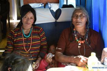 Tibetans take train home after journey of pilgrimage or travelling