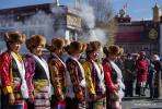 Dec.4,2017--Brightly costumed women pose for pictures to celebrate the Fairy`s Day in front of the Jokhang Temple in Lhasa, capital of southwest China`s Tibet Autonomous Region, Dec. 3, 2017. The Fairy`s Day falls on the 15th day of the 10th month of the Tibetan calendar. On that day, Tibetans celebrate the day to commemorate Buddha Aleanterre Brahm. (Xinhua/Liu Dongjun)