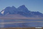 Dec. 12, 2017 -- Photo taken on Dec. 10, 2017 shows Doqen Co (Lake) and Mount Chomolhari in southwest China`s Tibet Autonomous Region. (Xinhua/Liu Dongjun)
