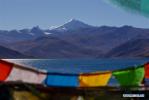 Dec. 12, 2017 -- Photo taken on Dec. 10, 2017 shows Yamzbog Yumco (Lake) and Mount Noijinkangsang in southwest China`s Tibet Autonomous Region. (Xinhua/Liu Dongjun)