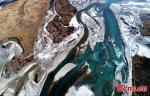 Dec. 15, 2017 -- The photo shows an aerial view of mountains and Yarlung Zangbo River in southwest China`s Tibet Autonomous Region. (Photo: China News Service/ Yang Jian)