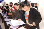 Dec.20,2017--In recent years, to alleviate employment pressure of college graduates, relevant departments of Tibet Autonomous Region have taken multiple measures to promote employment.Photo shows graduates filling out employment forms at a job fair. [China Tibet News/Tenzin Chosphel]