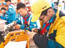 Dec. 21, 2017 -- Photos shows students from a robot club are assembling robots at the integrated pilot practical base for youth in Lhasa, capital city of southwest China`s Tibet. [Photo/chinatibetnews.com]
