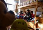 Dec. 26, 2017 -- An elder child reads stories to younger boys at the dormitory of an orphanage in southwest China`s Tibet Autonomous Region, Dec. 24, 2017. By the end of 2017, the region has established 11 orphanages with 5,711 orphans being adopted. (Xinhua/Jigme Dorje)