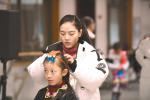 Jan. 19, 2018 -- Photo shows a dancing teacher is organizing hair accessory for a pupil in the Mass Art Museum of the Tibet Autonomous Region in Lhasa, capital city of the region in southwest China on Jan. 5, 2018. To enjoy their two-month winter holiday, some pupils choose to study dancing, some choose to learn calligraphy or painting, and some others choose to take exercises or read to spend their time.