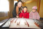 Jan. 19, 2018 -- Photo shows a teacher is teaching pupils to play the dulcimer in  the Mass Art Museum of the Tibet Autonomous Region in Lhasa, capital city of the region in southwest China on Jan. 7, 2018. To enjoy their two-month winter holiday, some pupils choose to study dancing, some choose to learn calligraphy or painting, and some others choose to take exercises or read to spend their time.