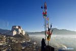 Jan. 22, 2018 -- A man replaces new prayer flags on his house in Xigaze, southwest China`s Tibet Autonomous Region, Jan. 19, 2018. Local people of Tibetan ethnic group have replaced prayer flags by new ones on the mountain and houses to celebrate New Year under the Tibetan calendar. (Xinhua/Purbu Zhaxi)