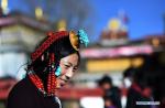 Jan. 31, 2018 -- A female pilgrim prepares to enter the Jokhang Temple in Lhasa, capital of southwest China`s Tibet Autonomous Region, Jan. 26, 2018. Many pilgrims came to Lhasa to pray for harvests and prosperity ahead of the Tibetan New Year. (Xinhua/Chogo)