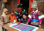 Feb. 11, 2018 -- File photo taken on Dec. 24, 2005 shows a woman of Miao ethnic group painting to greet the Spring Festival at Tonggu Village in southwest China`s Guizhou Province. As a country with 56 ethnic groups, China unfolds its charm of diversification during the Spring Festival. Spring Festival, or better known as Chinese Lunar New Year, is the most important festival for all Chinese, which has a history of more than 4,000 years. It is an occasion for home returning, New Year goods preparing, celebrating, and foremost, family reunion. (Xinhua/Qiao Qiming)