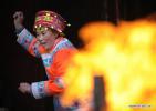 Feb. 11, 2018 -- File photo taken on Jan. 18, 2012 shows a villager of Tujia ethnic group performing hand-waving dance to celebrate the upcoming Spring Festival in Yongshun, central China`s Hunan Province. As a country with 56 ethnic groups, China unfolds its charm of diversification during the Spring Festival. Spring Festival, or better known as Chinese Lunar New Year, is the most important festival for all Chinese, which has a history of more than 4,000 years. It is an occasion for home returning, New Year goods preparing, celebrating, and foremost, family reunion. (Xinhua/Li Ga)