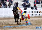 Feb. 20, 2018 -- Photo taken on February 18 shows a horseman performing `picking up hada on horseback`. [Photo/Xinhua]