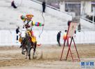 Feb.23,2018--Photo shows a horse rider performs during the Tibetan New Year holiday in Lhasa, capital city of southwest China`s Tibet, on Feb. 18. [Photo/Xinhua]