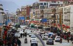 Feb. 24, 2018 -- Vehicles run on a street in Lhasa, capital of southwest China`s Tibet Autonomous Region, Feb. 12, 2018. Lhasa has put 128 new gas-electric hybrid buses on the road at the beginning of this year, making the number of new-energy buses to 312, or 60 percent of the city`s public bus fleet,local authorities said Friday. (Xinhua/Yang Meiduo)