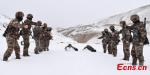 Feb. 26, 2018 -- Chinese border soldiers undergo intensive training on a snow-covered mountain 4,500 meters above sea level in Ngari Prefecture, Southwest China`s Tibet Autonomous Region as temperatures drop to minus 15 degrees centigrade. (Photo: China News Service/Liu Xiaodong)